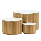 Set of three round wooden tables with white tops on a white background