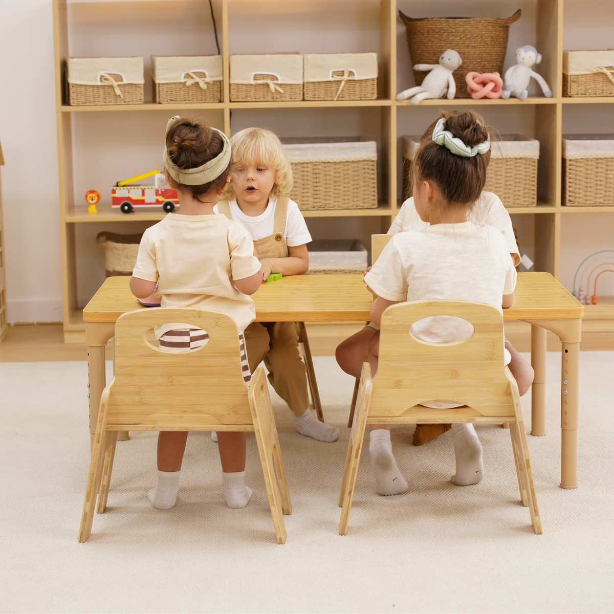 Toddlers having a snack at the Avenlur Adrian kids table