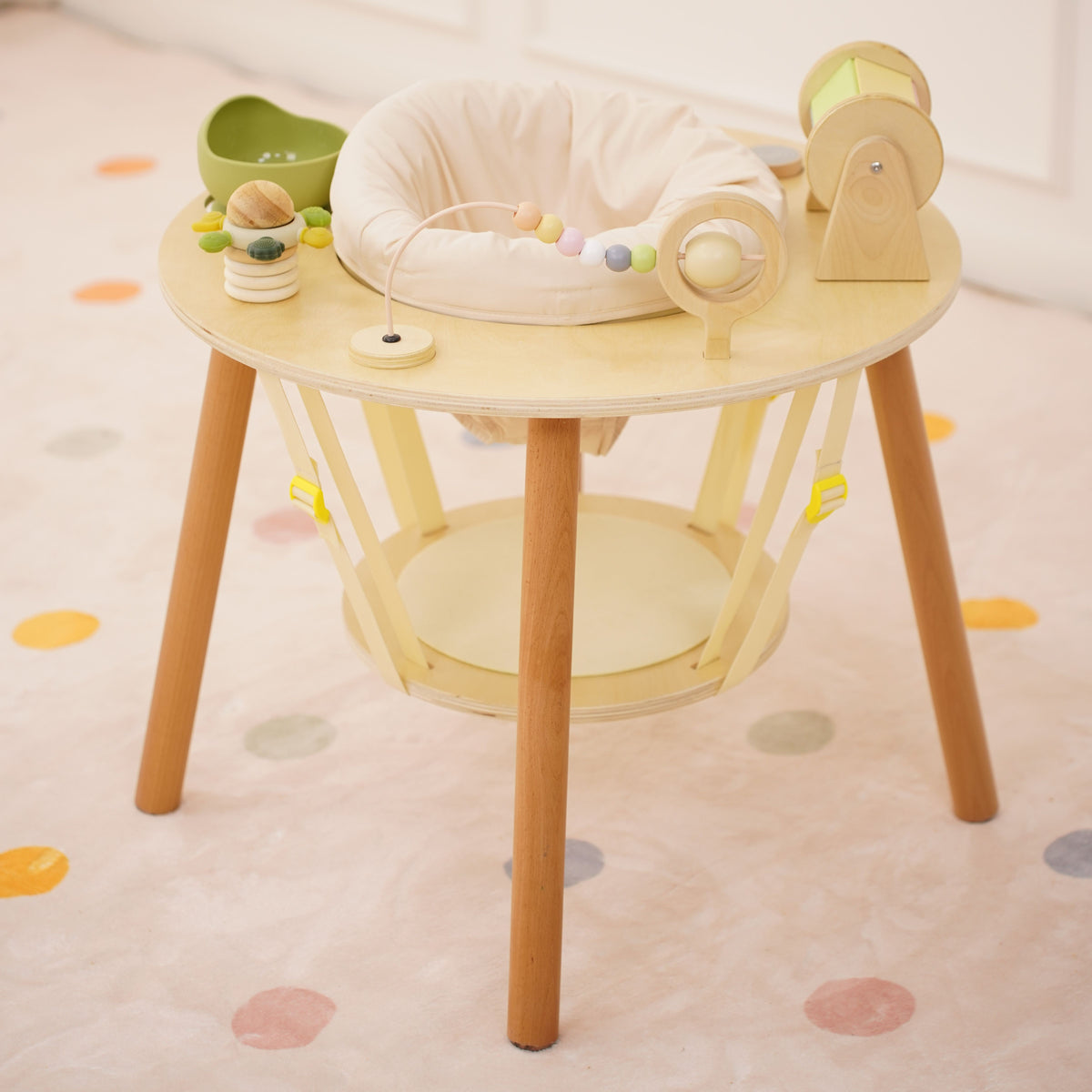 Baby standing at the Avenlur Aldar baby activity table