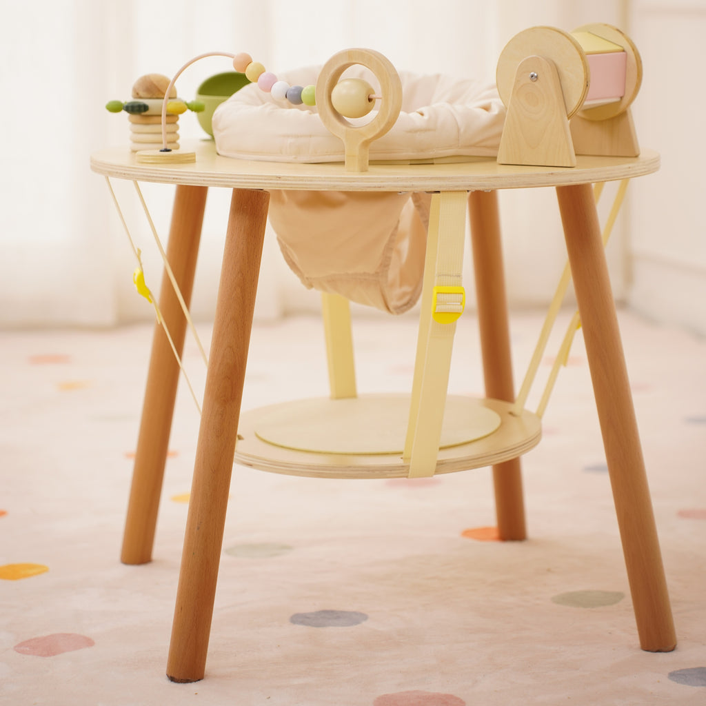Toddler playing at the Avenlur Aldar toddler activity table
