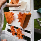 Close-up of the Aloe playhouse water wheel sensory activity panel with flowing water