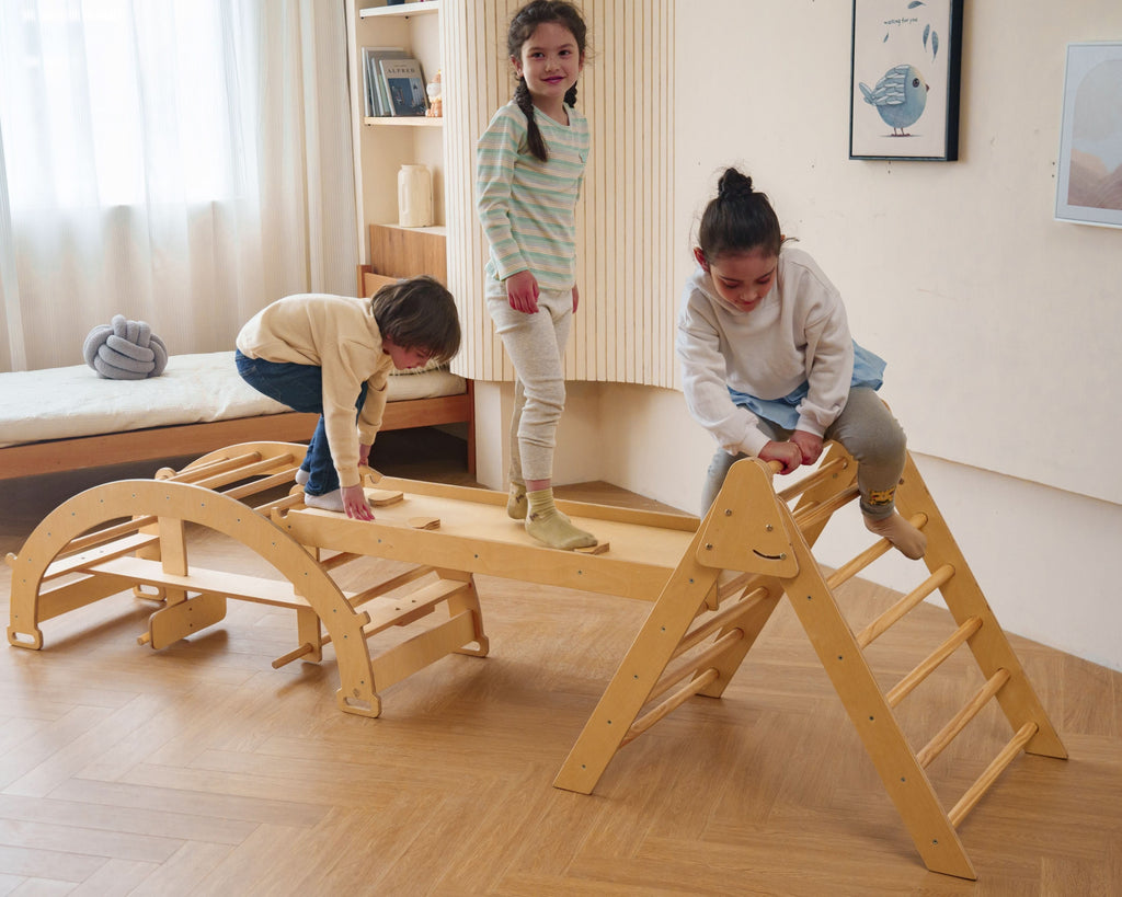 Toddler climbing the Avenlur Bazel Pikler climber at home
