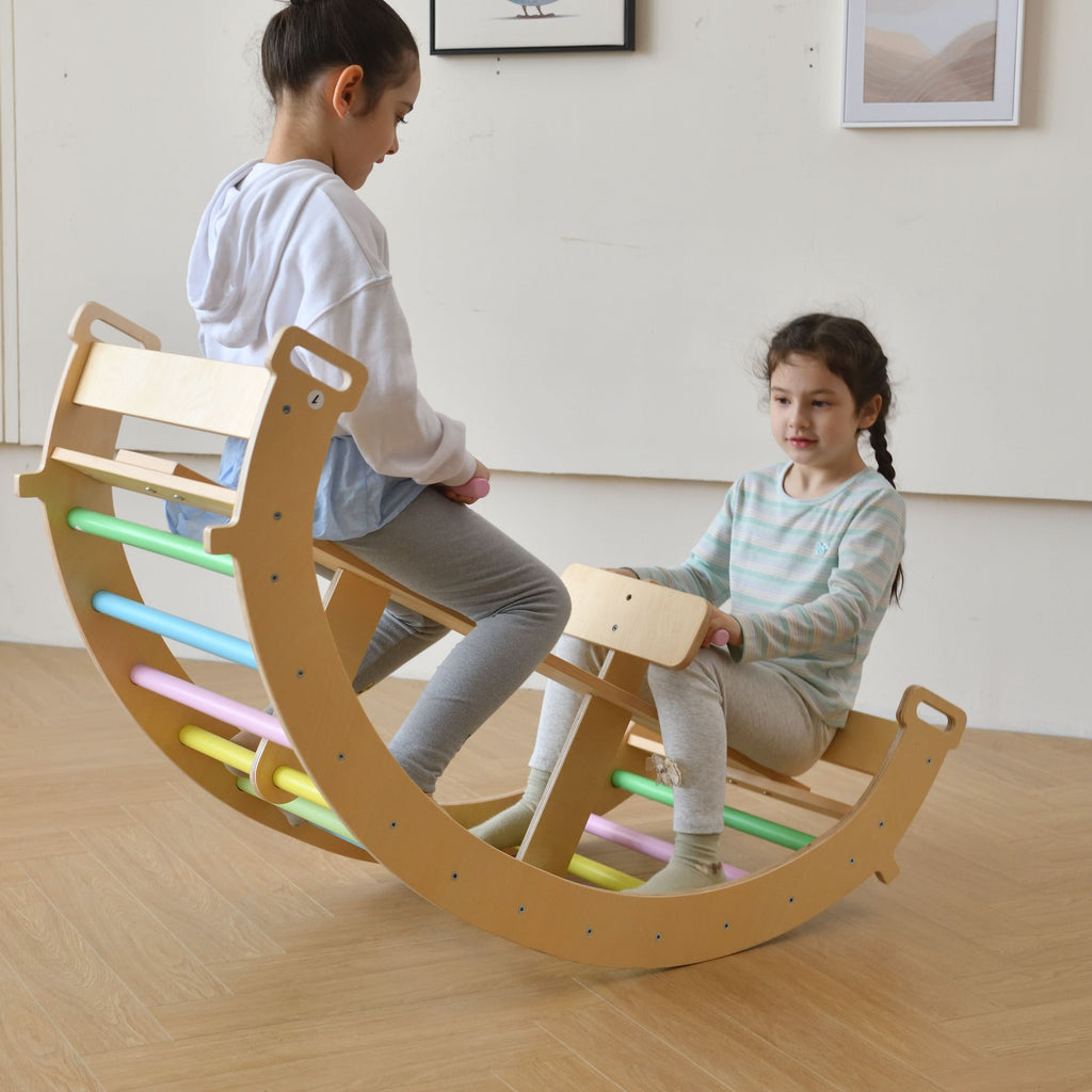 Toddler rocking on the Avenlur Bazel wooden rocker arch