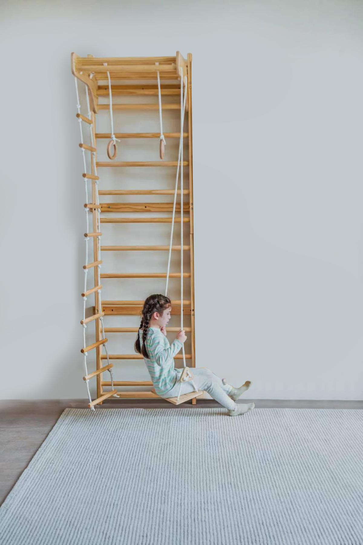 Kids playing on the Avenlur Betula wooden wall ladder at home
