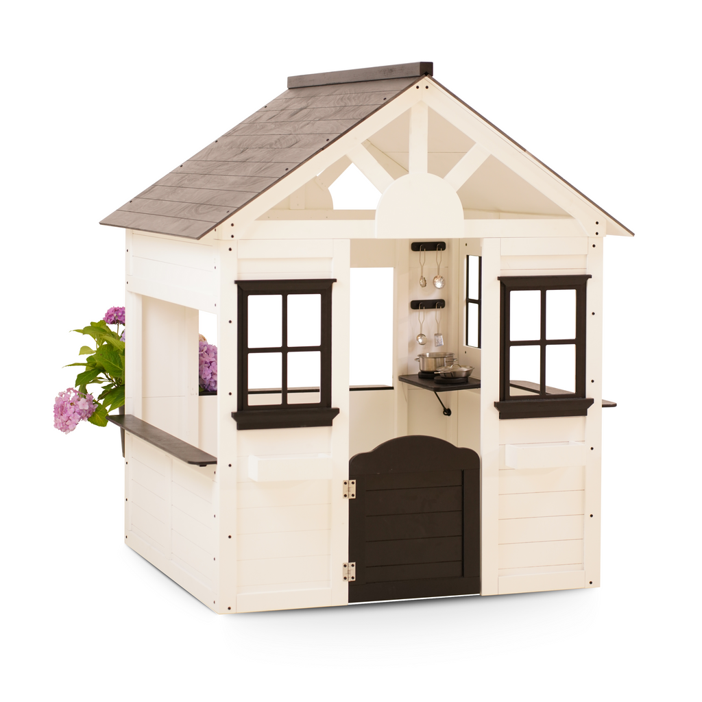 Avenlur Casa Modern White Wooden Playhouse with black trim, shown from the front angle, featuring a half-door and interior kitchen accessories.