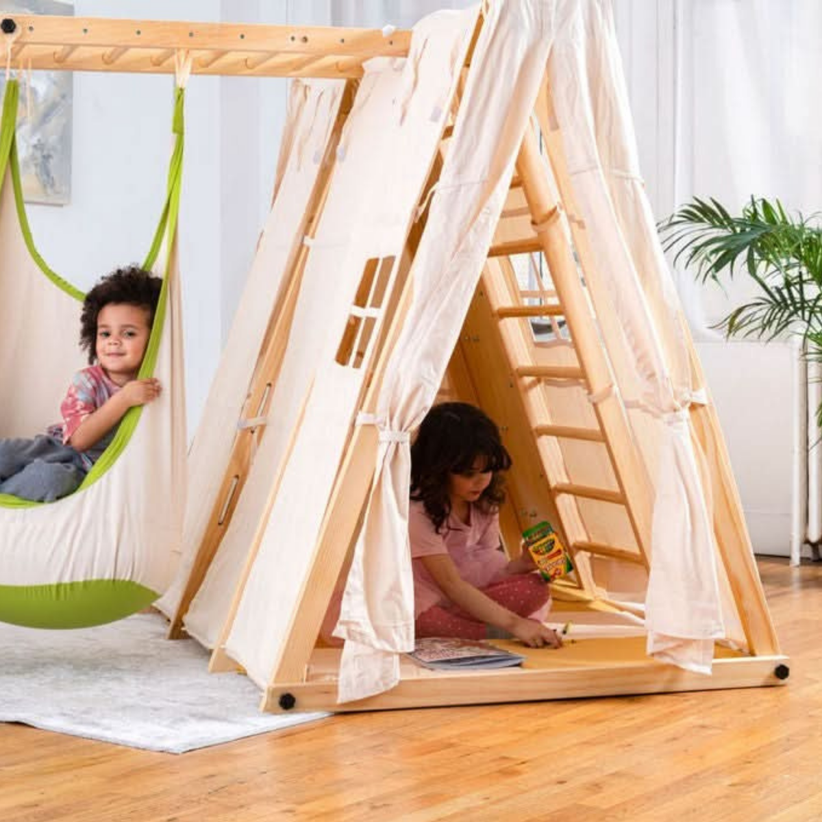 Kids playing inside the Avenlur Chestnut tent with a hanging swing