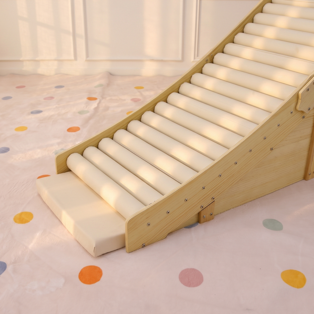 Toddler rolling down the Avenlur Hickory soft foam slide