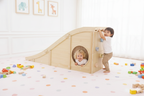 Toddler crawling through the Avenlur Hickory tunnel
