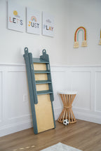 Toddler playing on the Avenlur Holland small indoor slide