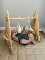 Close up of the Avenlur Rocket baby gym hanging toys
