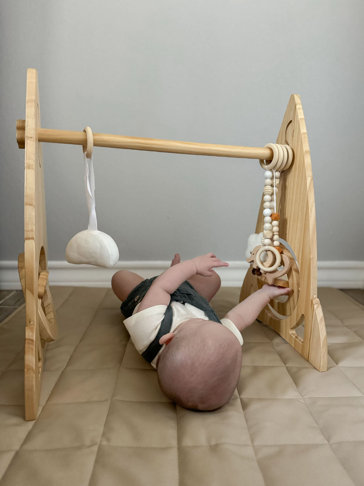 Avenlur Rocket wooden baby gym in a modern nursery