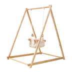 Toddler enjoying the Avenlur Spruce indoor swing