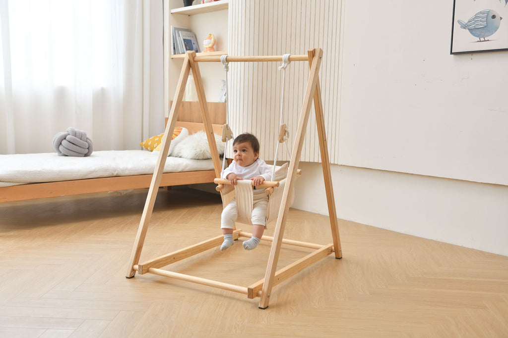 Avenlur Spruce wooden baby swing set in a nursery
