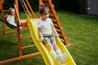 Wooden climbing ramp on the Avenlur Sycamore Jumbo swing set for toddlers and kids
