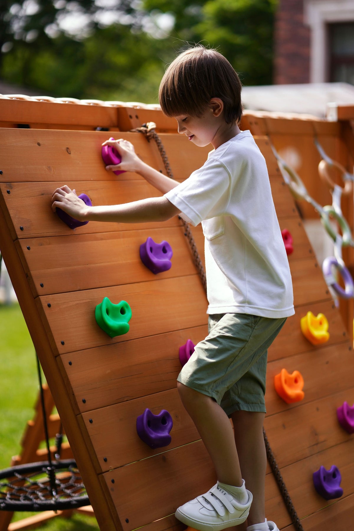 Avenlur Sycamore Jumbo kids outdoor play set with climbing ramp, swings and monkey bars