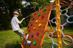 Avenlur Sycamore Jumbo outdoor play set for the backyard with climbing wall and trapeze