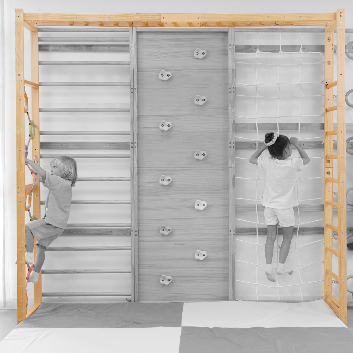 Kids swinging on the Avenlur Walnut monkey bar attachment