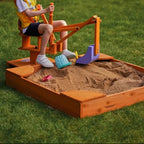 Avenlur wooden sandbox in the backyard, sized for a ride-on excavator