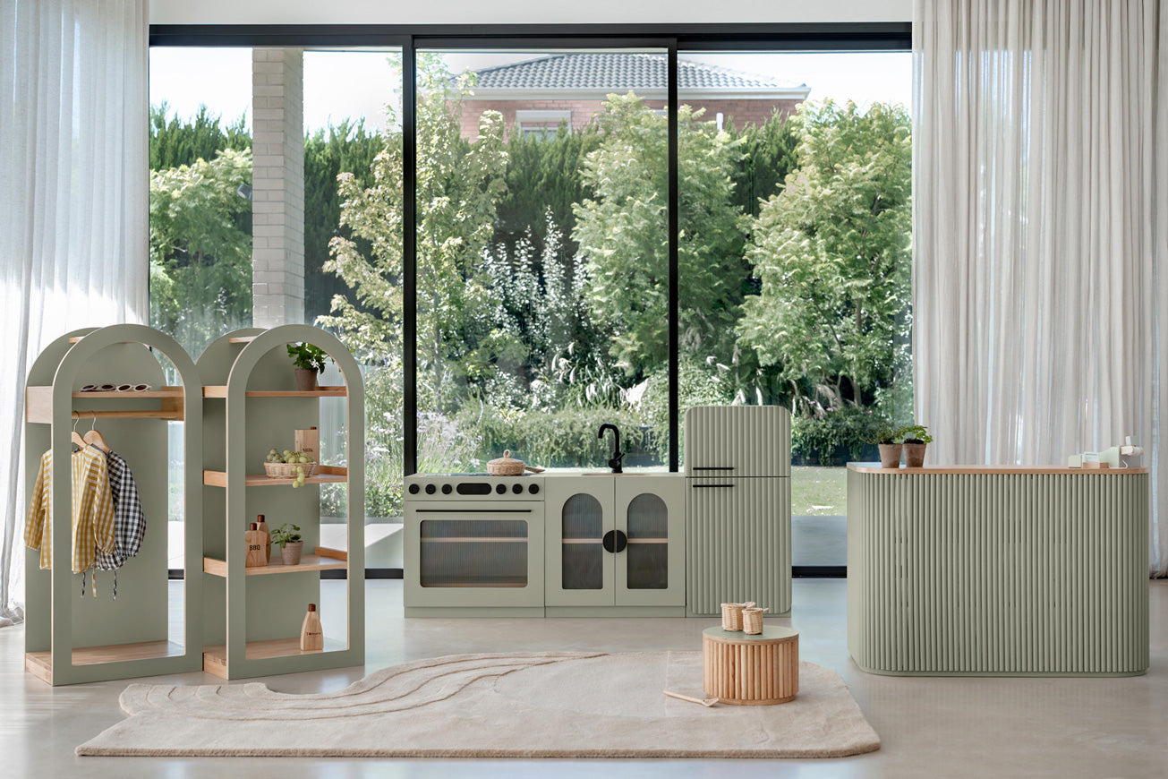 Sage Fluted play kitchen set with shelving in a Montessori room