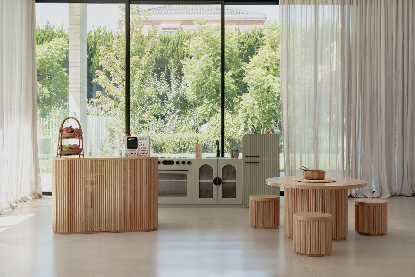 Sage Fluted play kitchen set with table and stools in a styled home setting