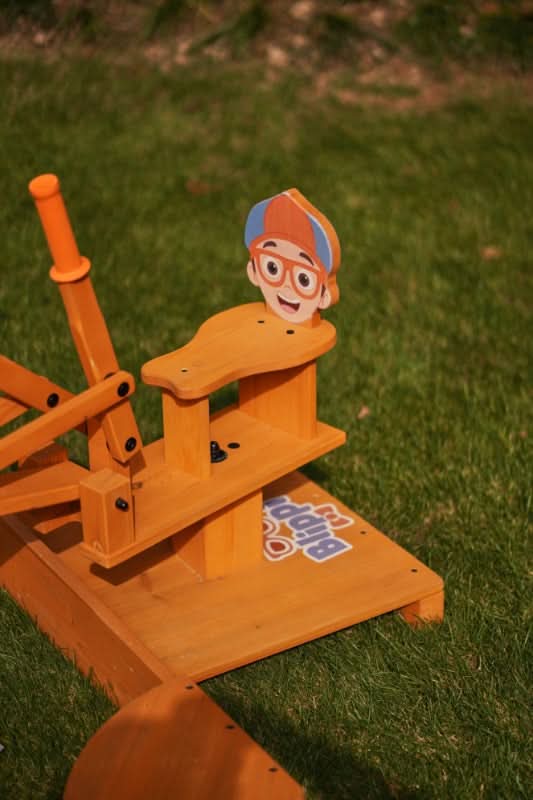 Blippi excavator with the arm raised