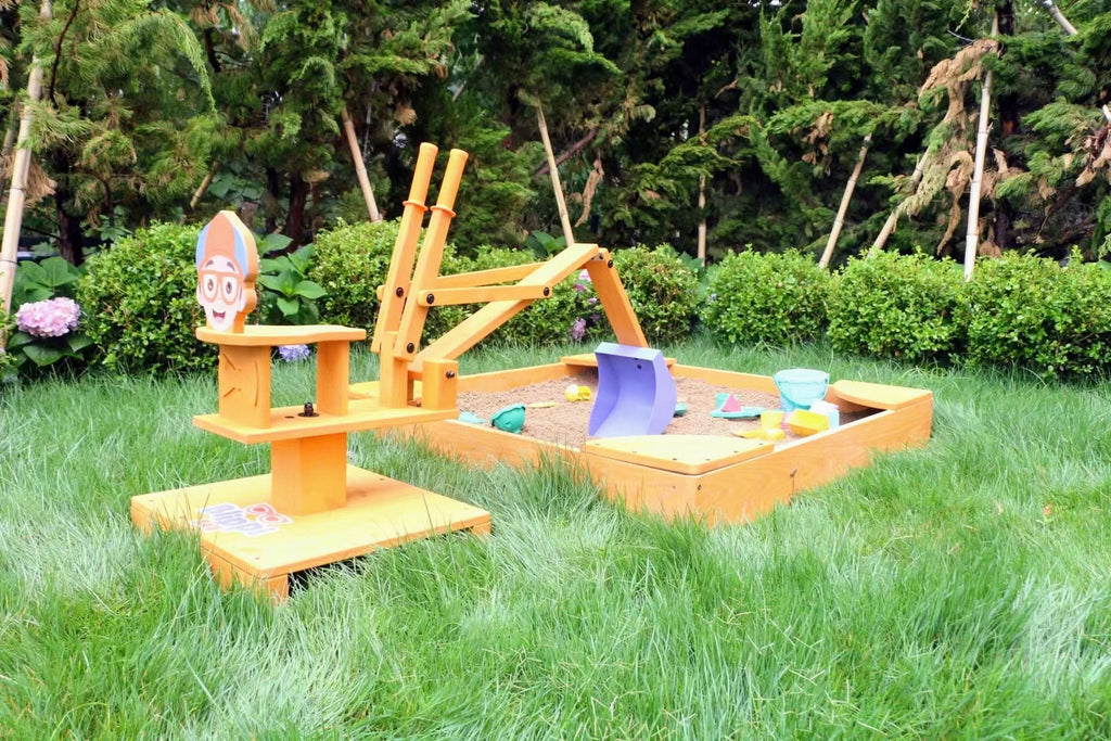 Toddler playing with the Blippi excavator toy