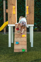 Rock climbing wall on the Avenlur Forest wooden swing set