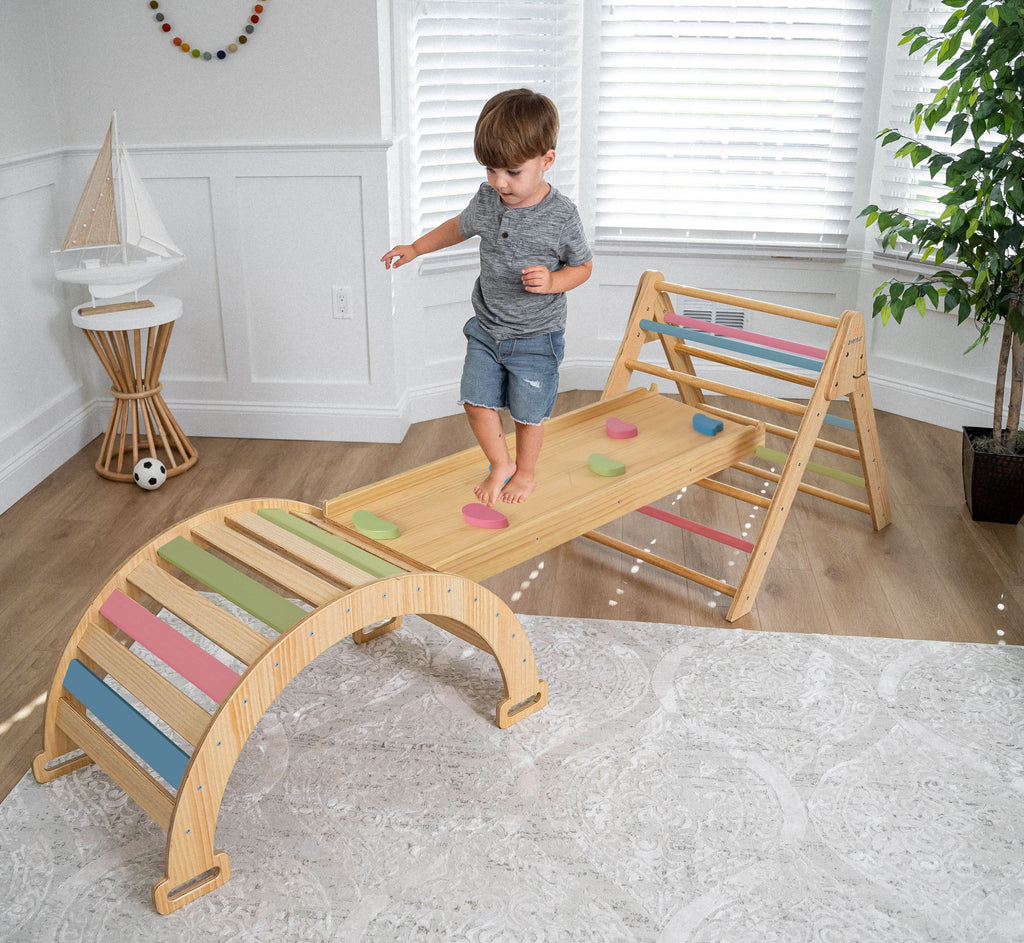Avenlur Hazel Pikler slide attached to the triangle in a playroom
