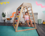 Avenlur Magnolia indoor wooden jungle gym in rainbow color finish with monkey bars, rock wall and slide