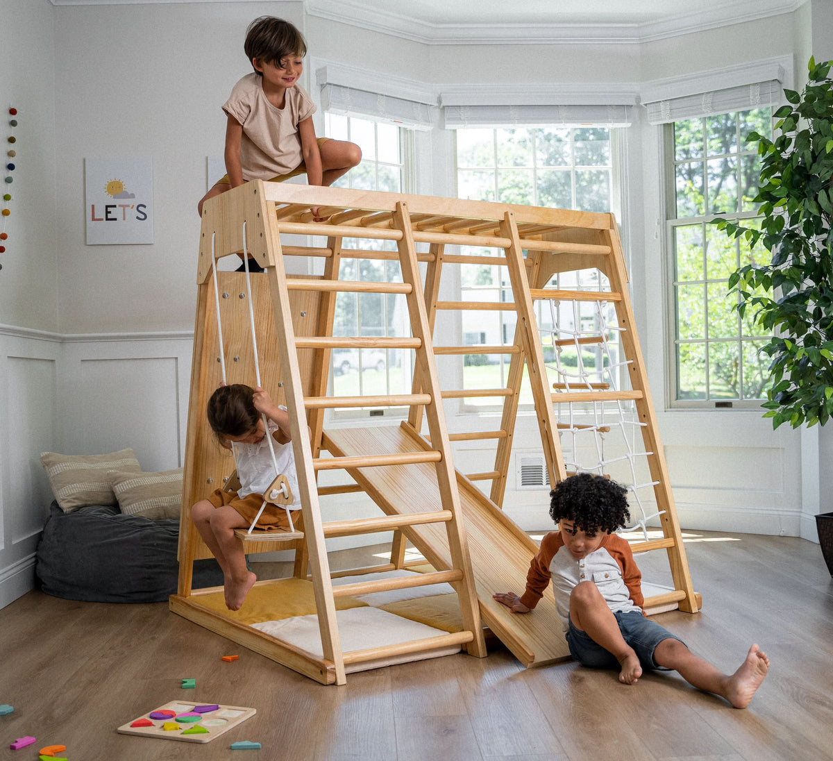 Avenlur Magnolia 7-in-1 wooden climbing gym with swing, slide and climbing net for indoor play