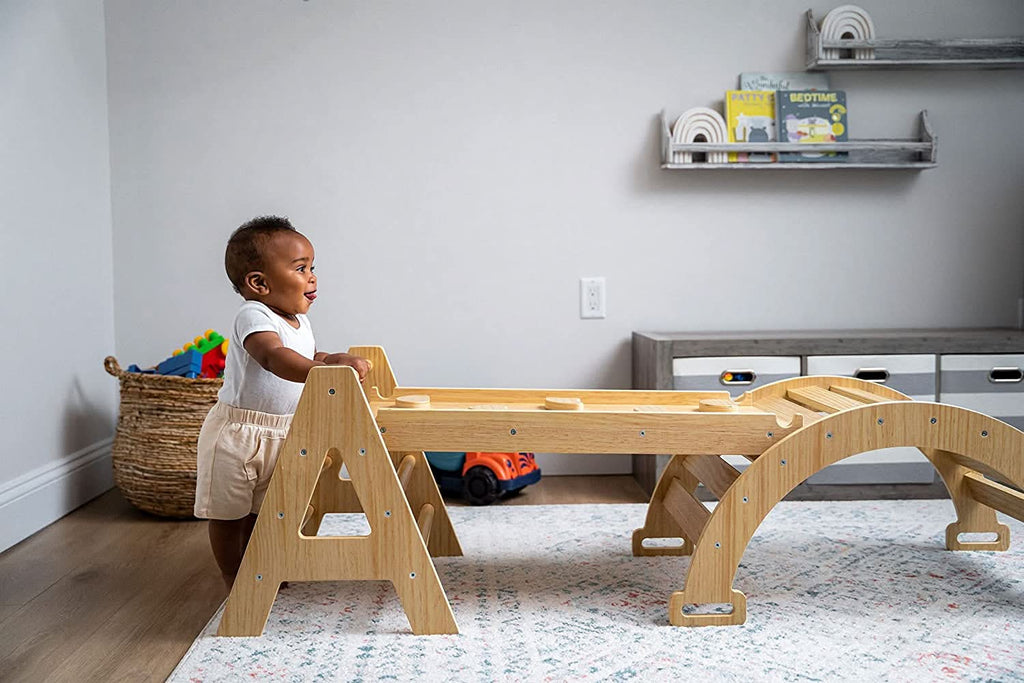 Baby pulling up on the Avenlur Maple baby climbing triangle