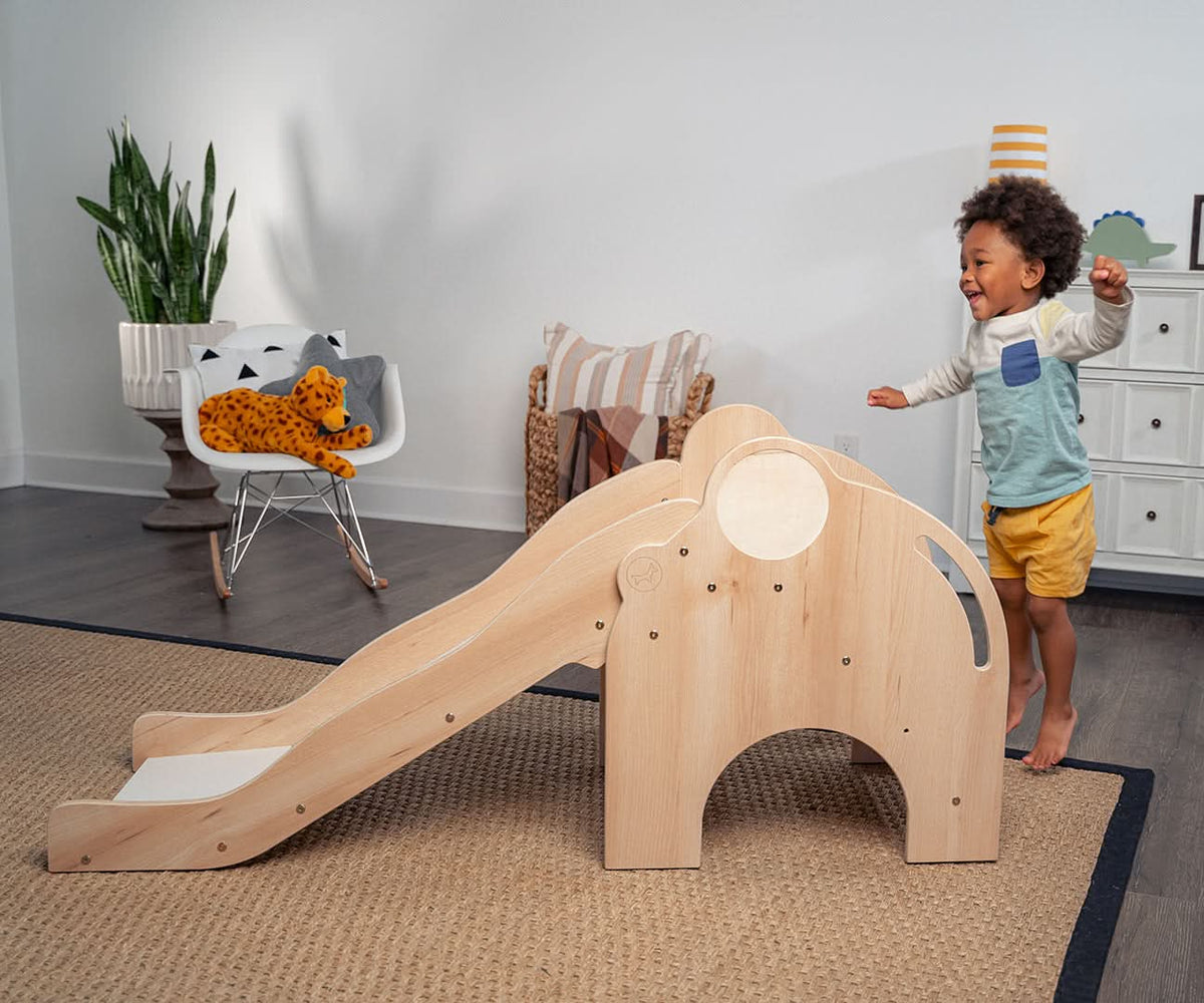 Child climbing the steps of the Avenlur Nima kids slide