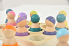Avenlur rainbow peg dolls in a small world play scene