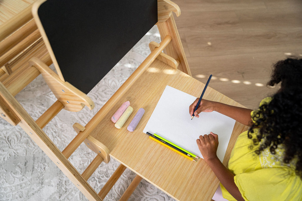 Child doing an art activity at the Avenlur toddler desk
